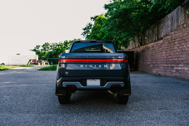 RAL UR Black Flap/Tang Logo - Rally Armor 22-25 Rivian R1T Black UR Mud Flap w/Tangerine Scream Logo