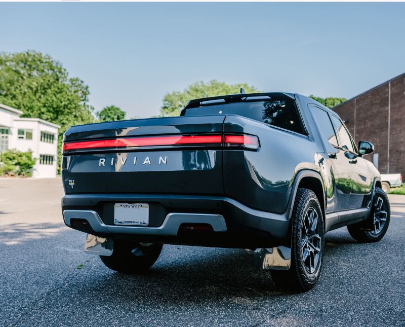 RAL UR Black Flap/Tang Logo - Rally Armor 22-25 Rivian R1T Black UR Mud Flap w/Tangerine Scream Logo